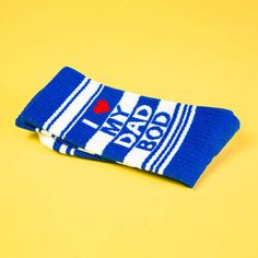 I <3 My Dad Bod Socks: The Perfect Accessory for the Comfy, Confident Dad. A pair of blue socks with white stripes that proudly proclaim "I <3 My Dad Bod" in bold red letters. A fun and lighthearted way to show off your dad pride. Sock Lovers, Red Letters, Blue Socks, Dad Bod, Next Fashion, Botanical Wedding, High Knees, Funny Socks, Novelty Socks