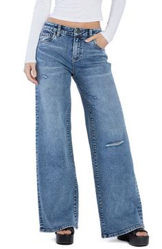 Floor-sweeping wide legs bring a stunningly chic look to these lightly distressed high-rise jeans made with a hint of shape-retaining stretch. 32" inseam; 24" leg opening; 10 1/2" front rise (size 27) Zip fly with button closure Five-pocket style 67% cotton, 29% REPREVE® recycled polyester, 3% rayon, 1% spandex REPREVE recycled polyester is made from 100% post-consumer recycled plastic bottles Machine wash, tumble dry Imported Distressed Wide Leg Flare Jeans With Relaxed Fit, Distressed Wide Leg Relaxed Fit Flare Jeans, Chic Distressed Wide Leg Pants, Chic Wide Leg Distressed Pants, Ripped Dark Wash Wide Leg Flare Jeans, Distressed Wide Leg Denim Flare Jeans, Light Wash Ripped Wide Leg Flare Jeans, Distressed Medium Wash Wide Leg Bottoms, Distressed Wide Leg Medium Wash Bottoms