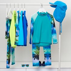 Our Tropical print is a favorite with our clients. There are so many items available in this print, ranging in sizes from 12 months up to 14-16Y Head over to our site now to check them all out! Tropical Horizon Long Sleeve Rash Guard #sunpoplife #sunprotectionclothing #rashguard #rashguards #sunprotectiveclothing #sunsafety #kidsrashguards #longsleeverashguards #kidsbeachwear #kidsswimwear #sunprotection Playful Green Swimwear With Uv Protection, Blue Stretch Rash Guard For Beach, Stretch Blue Rash Guard For Beach, Green Casual Rash Guard For Beach, Casual Green Rash Guard For The Beach, Playful Blue Swimwear For Water Sports, Casual Green Rash Guard For Beach, Blue Rash Guard With Uv Protection For Beach Season, Casual Summer Rash Guard With Uv Protection