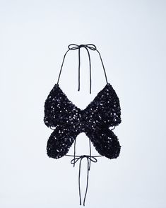 Pretty to see, hard to catch 🦋 This black butterfly top, made from sequin fabric and complete with a halter top style and tie back, will have them seeing stars in your eyes & your top 🤩 Chic Embellished Halter Top For Parties, Glamorous Sequin Halter Top For Evening, Halter Neck Top With Tie Back For Party, Summer Party Sequined Halter Top, Sequin Halter Top For Summer Party, Sequin Halter Neck Top For Night Out, Sequin Halter Top For Party Season, Sequin Halter Top For Evening Wear, Summer Sequin Halter Neck Top