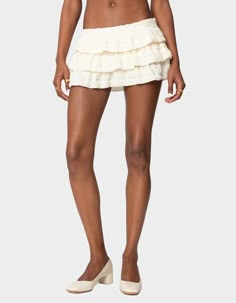 No Closet Is Complete Without The Perfect Mini Skort That Adds A Bit Of Flair To A Simple Top. This Ruffled Option Can Pair Perfectly With Anything You Have In Mind. Mini Skort. Tiered Ruffle Design. Side Zip Closure. Textured Fabric. 100% Polyester. Model Wears Size S. Model Height Is 5'9. Item Care: Machine Wash At Maximum 30ºc, Do Not Bleach, Do Not Tumble Dry, Iron At A Maximum Of 110ºc, Do Not Dry Clean. | Edikted Margaux Textured Ruffle Mini Skort Matching Mini Skirt And Top Set, Silk Skirt Mini, Goldilocks Costume, Gold Bengals, Cow Boy Hat, European Vacation Outfits, White Ruffle Mini Skirt, Mini Ruffle Skirt, Boho Chic Skirts