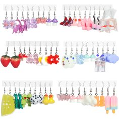 several key chains with different designs and colors hanging from hooks on the wall in front of each other