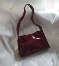 ✨ Elevate your style with our Burgundy Elegance handbag! ✨ Crafted from luxurious patent leather, this stunning accessory seamlessly combines sophistication with a touch of modern flair. The deep burgundy hue exudes confidence and versatility, making it the perfect companion for any occasion. 🌟 🎁 Perfect Gift: Surprise a special woman in your life with the Burgundy Elegance handbag - a timeless and elegant gift that will leave a lasting impression. Carry sophistication wherever you go with our Burgundy Elegance handbag. Embrace the confidence that comes with a stylish accessory that complements your unique personality. Order yours now and make a statement in every stride! 👜✨ Hello, Thank you for choosing to shop with us on Etsy! We appreciate your support and are thrilled to be able to Trendy Burgundy Tote Shoulder Bag, Retro Burgundy Shoulder Bag, Retro Burgundy Bags For Daily Use, Retro Burgundy Shoulder Bag For Daily Use, Retro Burgundy Rectangular Bag, Trendy Burgundy Rectangular Shoulder Bag, Trendy Burgundy Rectangular Satchel, Trendy Burgundy Tote Satchel, Retro Burgundy Rectangular Shoulder Bag