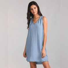 Crafted From A Lightweight Lyocell Fabric, This Denim Dress By Gap Has A Soft And Breezy Feel. Put Together In A Shift Silhouette, It's Minimally Detailed With A V-Neck And No Sleeves. Style It With White Kicks For A Contemporary Vibe. Washed Blue Cotton V-neck Dress, Gap Sundress For Beach, Chic Washed Blue Sleeveless Dress, Casual Washed Blue V-neck Dress, Casual Blue Linen Dress For Daywear, Casual Blue Linen Dress For Day Wear, Gap Summer V-neck Dress, Blue Gap Denim Summer Dress, Gap Blue Denim Summer Dress