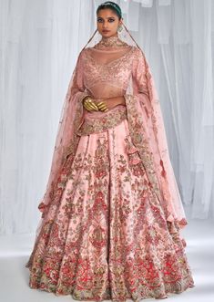 Peachy pink raw silk bridal lehenga with two tulle dupattas and an embroidered blouse. Heavy Bridal Lehenga, Dolly J, Silk Bridal Lehenga, India Outfits, Balyage Hair, Pink Bridal Lehenga, Saree Drapes, Sabyasachi Sarees, Raw Silk Lehenga