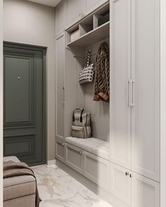 a large white closet with some bags and purses on it