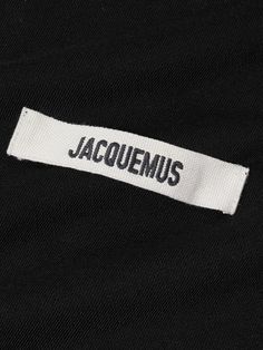 a black jacket with the word jacquemus on it's chest and white lettering