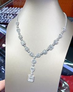 You'll never tire of wearing this unique and sophisticated eternity, Illusion diamond necklace. Stunningly set in 18K solid white gold, this breathtaking line of shimmering round & baguette diamonds necklace. So elegant, at 17.0-inch, this diamond necklace will take the viewers breath away. With over 10.21 cts. t.w. of sparkling, NATURAL, UNTREATED diamonds, all optimally cut to display maximum brilliant luster, this glamorous keepsake secures with a slide clasp lock as shown. The setting design Luxury Baguette Cut Necklace For Wedding, Diamond Solitaire Necklace With Baguette Diamonds For Anniversary, Exquisite White Gold Necklace With Emerald Cut, Exquisite Emerald Cut Diamond Necklace, Formal Platinum Necklace With Emerald Cut, Wedding Fine Jewelry Solitaire Baguette-cut Necklace, Elegant Silver Emerald Cut Diamond Necklace, Silver Diamond Necklace With Emerald Cut Single Diamonds, Emerald Cut Cubic Zirconia Diamond Necklace For Anniversary