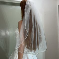 the back of a bride's head wearing a veil