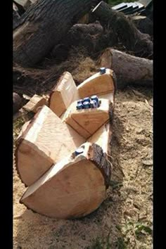 an image of a wooden bench made out of logs