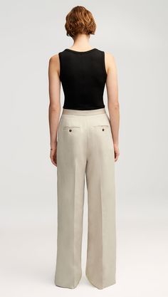 Our lightweight Jones Trouser is a quintessential piece that strikes a flawless balance between form and function. Made of breezy Italian linen, this pant features two back pockets in addition to a hidden credit card pocket in the front. Pair with a camisole, cardigan, and sandals for a classic outfit that will take you from season to season. Elegant Neutral Bottoms With Welt Pockets, Versatile Tailored Bottoms With Straight Hem, Modern Bottoms With Welt Pockets For Everyday, Neutral Bottoms With Welt Pockets For Business Casual, Formal Neutral Bottoms With Pockets, Elegant Spring Bottoms For Everyday, Elegant Everyday Bottoms For Spring, Elegant Everyday Spring Bottoms, Modern Pants With Straight Hem For Summer