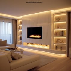 modern living room with fireplace and built - in shelving units on the wall, along with white couches