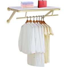 a rack with clothes hanging from it's sides