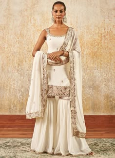 Off White Embroidered Gharara Suit – Lashkaraa Gharara Designs Indian, One Piece Dress Indian Style, White Indian Outfit, Suit Designs Indian Style, Indian Wedding Guest Dress, Anarkali Salwar Suits, Gharara Designs, Dupatta Embroidery, Gharara Suits