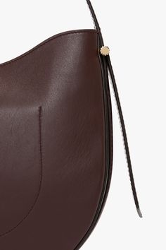 Elevate your everyday style with the Victoria Beckham Hobo Bag in burgundy, where timeless sophistication meets practical design. Crafted from the finest supple leather, this bag offers a relaxed silhouette that embodies understated luxury. Its slouchy, yet structured shape drapes beautifully whether worn over the shoulder or carried by hand, offering a versatile, casual-chic look. Victoria Beckham Medium Dia Hobo Bag In Burgundy Smooth Leather  - Size ONE SIZE UK Brown Calf Leather Hobo Bag For Business, Brown Smooth Grain Hobo Bag For Work, Business Brown Calf Leather Hobo Bag, Classic Business Hobo Satchel Bag, Classic Business Satchel Hobo Bag, Classic Hobo Business Bag Satchel, Timeless Leather Hobo Bag For Formal Occasions, Classic Calf Leather Hobo Shoulder Bag, Formal Brown Soft Leather Hobo Bag