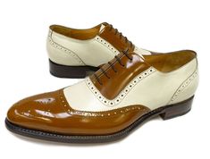 Polished Calfskin Lace-Up Spectator Oxford Camel/Bone Completely Handmade, this Stunning Polished Calfskin slip-on SpectatorOxford from the Ugo Vasare collection features Goodyear Welted construction, a Faux Lace, Decorative Perforations with a Toe Medallion, a stitched welt and a full Leather sole! Don't see your size? Call us to arrange a Special Order in Your Size. Classic Beige Oxfords For Business, Beige Wingtip Oxfords For Formal Occasions, Formal Beige Oxfords With Leather Sole, Classic Cream Oxfords With Leather Sole, Classic White Fitted Oxfords, Fitted Slip-on Oxfords For Galas, Classic Cream Oxfords For Formal Occasions, Suede Lace-up Shoes With Cap Toe And Leather Sole, Leather Slip-on Oxfords With Contrast Sole