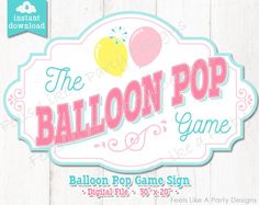 the balloon pop game sign is displayed on a wooden background