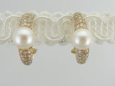 These vintage earrings are in excellent condition. Large pearls, with their bright white color and soft luster are sophisticated and yet sexy at the same time. The diamond accents bring some glitter to these pieces, easy to wear with a suit or a wedding dress! Metal: 18K yellow gold Stone: White Pearl, 8.5 mm Accent: 92 diamonds = 1.32 carat Earring Length: 22 mm Earring Width: 8.5 mm Gold For Sale, Mabe Pearl, A Wedding Dress, Gold Stone, White Pearl, Cultured Pearls, Eternity Bands, Vintage Earrings, Pearl White