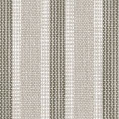 an upholstered striped fabric with grey and white stripes