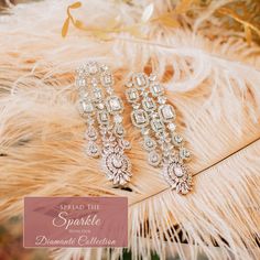 Be splendidly sophisticated in our Janella Earrings! These intricate & elegant earrings feature CZ stones, making it a perfect pick for a special occasion. Approximate earrings length is 3.25". Silver-plated on high-quality brass as base metal. In-stock & ready-to-ship. *Please Note: We use faux stones and beads in all of our jewelry. Glamorous Diamond Drop Bridal Earrings, Glamorous White Diamond Earrings, Glamorous Sparkling Diamond White Chandelier Earrings, Glamorous Sparkling Bridal Earrings For Anniversary, Glamorous Chandelier Earrings With Sparkling Stones For Anniversary, Glamorous Sparkling Chandelier Earrings For Anniversary, Sparkling Diamond White Drop Chandelier Earrings, Glamorous Diamond Earrings For Anniversary, Glamorous Crystal Chandelier Earrings With Elegant Design