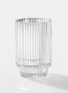 a clear glass vase sitting on top of a table