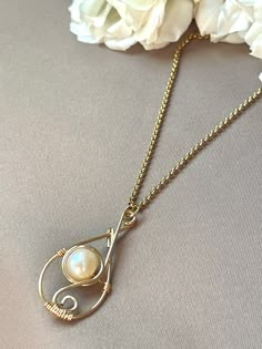 "Wear this necklace for its elegant handmade freshwater pearl teardrop wire handmade pendant. Great for holiday gift, gift for mom, gift for sister, gift for wife, gift for girlfriends, etc.! 1.5\" total pendant height freshwater pearl non tarnish 20\" cable chain necklace hypoallergenic 18k gold plated" Wire Wrapped Pearl Necklace, Wire Wrapped Pearl, Handmade Pearl Necklace, Pearl Earrings Handmade, Wire Wrap Jewelry Designs, Elven Jewelry, Wire Wrapped Jewelry Diy, Bijoux Fil Aluminium, Handmade Pendant Necklace