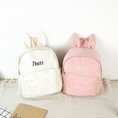 ✦ Production Time: 8-10 business days ✦ Shipping Time: USPS Ground/3-5 business days, USPS Priority/1-3 business days Hop into a world of cuteness and practicality with our adorable Bunny Backpack! This Custom Backpack is perfect for kids and toddlers, combining charm and functionality to make school days and outings extra special. ✦ Perfectly Sized: 9.5''-4.5''-12'' It's spacious enough to hold books, toys, snacks, and everything they need for their adventures. ✦ Vivid Colors: White, Black, Pin Cute Student Backpack With Letter Print, Portable Bags As Back To School Gift, Portable Bag As Back To School Gift, Portable Bag As A Back To School Gift, Cute School Bag With Letter Print, Student Bags With Letter Print For Back To School, Back To School Bags With Letter Print, Back To School Gift Backpack, Softback Bags For Students End Of School Year