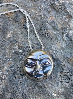 "A happy, bright-eyed, wide awake Full Moon Necklace carved in traditional Tlingit Native style crossing boundaries of culture and geography bringing us light and joy. As with all of my jewelry, I first carved this piece in wax then had it cast in eco friendly reclaimed sterling silver. Size approx. 7/8\" diameter. Includes 20\" Sterling Silver chain. Your Full Moon Necklace will arrive in a lovely royal blue velveteen pouch with story card and polishing cloth included. Gift boxing available! Le Sterling Silver Amulet Necklace With Large Pendant, Sterling Silver Moon Charm Amulet Necklace, Crossing Boundaries, Handmade Moon-shaped Amulet Jewelry, Silver Moon-shaped Amulet Necklace, Full Moon Necklace, Nickel-free Moon Shaped Spiritual Necklace, Wide Awake, Native Style