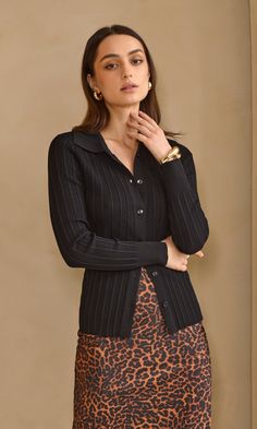 Button-up, rib knit shirt with collar and long sleeves. This tight-fitted shirt is seen in any outfit, with trousers or a skirt. Knit Top Long Sleeve Button Front Length: 21 1/2" Chest: 18 1/2" Self: 53% Nylon, 47% Viscose Hand wash in cold water. Lay flat to dry. Low iron. Model is wearing a size small Style #: G249WT6047 Knit Top Long Sleeve, Skirt Knit, Knit Polo Shirt, Shirt With Collar, Sweater Jumpsuit, Fitted Shirt, Tops And Blouses, Knit Polo, Knit Shirt