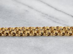 Dating to the late 1800s or early 1900s, this antique chain is detailed with formed, ribbon-like links. The craftsmanship is superb, each link forming a tiny work of art. The style is very gothic and would be suitable for a man or a woman, perfect alone or worn with a pendant. Metal: 14K Yellow GoldWidth of Chain: 5.0 mmLength of Chain: 24 InchesMarks: "14KT" Stamped on the clasp Victorian Style Formal Jewelry With Chain, Victorian Style Formal Gold Chain Jewelry, Victorian Gold Chain Jewelry For Formal Occasions, Antique Style Formal Chain Necklace, Victorian Gold Chain Necklace For Formal Occasions, Victorian Gold Chain Necklace For Formal Events, Antique Curb Chain Necklace With Oval Links, Antique Style Oval Link Chain Necklace, Victorian Necklace With Oval Link Curb Chain