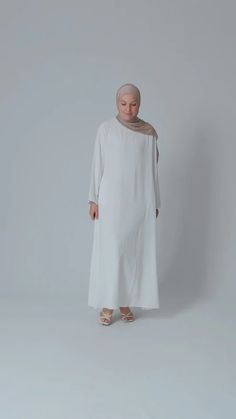 White Kira Maxi Slip Dress with Pockets & Long Sleeve – ANNAH HARIRI Summer Flowy Long Sleeve Abaya, Flowy Summer Abaya, Summer Long Sleeve Flowy Abaya, Flowy Long Sleeve Summer Abaya, White Floor-length Abaya, Summer Long Sleeve Abaya, Modest Flowy Maxi Length Abaya, Modest Flowy White Maxi Dress, Flowy Long Sleeve Modest Maxi Dress