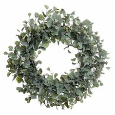 a wreath with green leaves and greenery