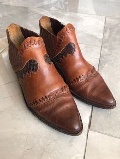 "Vintage genuine leather cowboy / western ankle boots made by Palomino. Awesome retro pair of boots! No tag present, fits as a women 6.5. Fantastic condition, I believe they have been re-soled. Measures approx. 10.5\" long, 3.5\" wide, 4.5\" tall." Western Ankle Boots, Vintage Cowboy, Cowboy Western, Western Cowboy Boots, Western Cowboy, Western Boots, Boot Shoes Women, Dress Shoes Men, Oxford Shoes