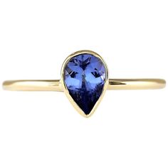 Introducing our exquisite 14 Karat Yellow Gold Ring adorned with a stunning 0.50 Carat Natural Tanzanite gemstone. Stamped for authenticity, this ring weighs a mere 1.2 grams, ensuring comfort and wearability. The Tanzanite gemstone, boasting a weight of 0.50 carats, showcases a mesmerizing hue and measures 6.00x4.00 mm. With its elegant design and vibrant gemstone, this ring adds a touch of sophistication to any ensemble. Elevate your look with this timeless treasure, crafted to inspire and captivate. 0.50 Carat Natural Tanzanite 14 Karat Yellow Gold Ring Stamped: 14K Yellow Gold Total Ring Weight: 1.2 Grams Natural Tanzanite Weight is 0.50 Carat Face Measures: 6.00x4.00 mm Sku: [703381W] Diamonds Bangles, Crystal City, Tanzanite Stone, Gold Rings Fashion, Daily Jewelry, Tanzanite Ring, Tanzanite Gemstone, Cabochon Jewelry, Modern Ring