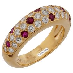 This classic authentic Cartier ring is crafted in 18k yellow gold and pave-set with brilliant-cut round E-F-G VVS1-VVS2 diamonds and round red rubies. Made in France circa 1994. Measurements: 0.23" (6mm) width. The ring size is 6.25 - EU 53. Resizable. Sizing fees will be provided upon request. Excellent condition. Comes with original box without paperwork. Cartier Yellow Gold Round Cut Rings, Luxury Round Ruby Ring With Diamond Accents, Luxury Ruby Ring With Diamond Accents And Round Shape, Cartier Yellow Gold Diamond Ring With Brilliant Cut, Cartier Yellow Gold Rings With Prong Setting, Cartier Rings In Yellow Gold With Pave Setting, Luxury Red Ring With Pave Setting, Luxury Red Diamond Ring With Single Cut Diamonds, Gold Ruby Rings With Pave Setting