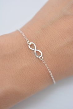 HAND-MADE OF SOLID STERLING SILVER PARTS - A GREAT KEEPSAKE I make this beautiful bracelet using a tiny 1/2 inch sterling silver infinity charm with an antiqued finish. Set on sterling silver chain, this bracelet secures with a lobster clasp. Each comes in a gift box, perfect for gift-giving. These make great group gifts. SIZING - IMPORTANT: To determine bracelet size, measure around your wrist and add 1/2 inch to get your bracelet size. Do not order in your exact wrist measurement as it will NO Simple Silver Jewelry For Friendship, Minimalist Infinity Jewelry For Friendship, Simple Hypoallergenic Sterling Silver Bracelets, Sterling Silver Infinity Bracelets For Everyday, Sterling Silver Infinity Bracelet For Everyday, Dainty Infinity Jewelry For Friendship, Minimalist Silver Infinity Bracelet, Dainty Infinity Friendship Jewelry, Hypoallergenic Sterling Silver Infinity Jewelry