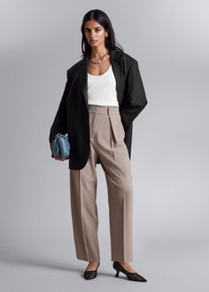 Tailored high-waist trousers featuring a tapered leg, pleated detailing and press creases. • Belt loops• Zip fly with hook and bar closure• Duo slanted side pockets• Duo back welt pockets High-waisted Wide Leg Pants With Pressed Crease For Work, Modern Tapered Leg Bottoms For Workwear, Sleek Wide Leg Workwear Pants With Pockets, Modern Tapered Leg Workwear Bottoms, Sleek Business Bottoms For Spring, Sleek Spring Business Bottoms, Chic Wide Leg Business Pants With Pockets, Chic Business Pants (trousers), Chic Tapered High-waist Pants