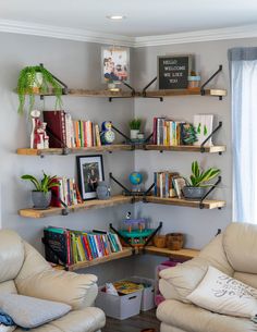 a living room filled with furniture and bookshelves covered in lots of different types of books