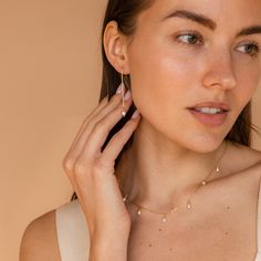 It’s as easy as pie to throw on our Pearl Threader Earrings and put an outfit together. Glamorous and dainty, these dangling charm earrings are minimalistic and perfectly stack with other earrings in your collection. Material: High Quality Solid 925 Sterling Silver Finish: 18K Gold ∙ Sterling Silver Featuring ~0.7mm Thick Chain Earrings ~60mm in Length, with a ~5.5x4.5mm Pearl Charm Sold as a pair Part of our Pearl Collection Model showcases a glamorous, event-ready look featuring Pearl Station Minimalist Pearl Chain Drop Threader Earrings, Minimalist Pearl Drop Threader Earrings, Minimalist Wedding Threader Earrings With Pearl Charm, Elegant White Pearl Threader Earrings, White Pearl Threader Earrings With Charm, Pearl Threader Earrings, Initial Tag Necklace, Sideways Initial Necklace, Fingerprint Necklace