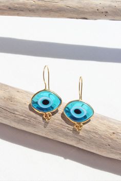 These beautiful earrings feature organic-shaped evil eye beads crafted from glass, each one capturing the ancient symbolism of protection against negative energy. 14K Gold Plated Evil Eye Glass Bead Drop Earrings, Organic Shaped Turkish Evil Eye Hook Earrings, Sterling Silver Nazar Protection Earrings, Summer Jewelry Bohemian Evil Eye Earrings As Gift, Gold Evil Eye Earrings As Gift, Adjustable Gold Evil Eye Earrings, Bead Drop Earrings, Turkish Evil Eye, Eye Hook, Eye Glass, Beaded Drop Earrings, Summer Jewelry