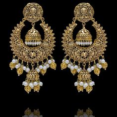 A fun pair with classic deign that never goes out-of-style! Gorgeous pair of earrings that is a perfect pick to pull-off any traditional or ethnic look. With its beautiful metal carving, embossed details and timeless jhumki design with an addition to pearl moti, this pair is all you need for the upcoming events. Kajal Earrings are available in two sizes. Big earrings are about 4.5" long and small earrings are about 3" long. Gold-plated on high-quality brass as base metal. Delivery time frame is Ornate Jhumkas For Pierced Ears, Festive Bridal Earrings With Intricate Metal Design, Metal Chandbali Chandelier Earrings With Intricate Design, Ornate Brass Chandbali Earrings, Ornate Jhumkas For Festivals With Pierced Ears, Traditional Metal Bridal Earrings With Intricate Design, Ornate Metal Earrings For Festive Occasions, Traditional Metal Bridal Earrings, Festive Metal Hoop Earrings With Intricate Design