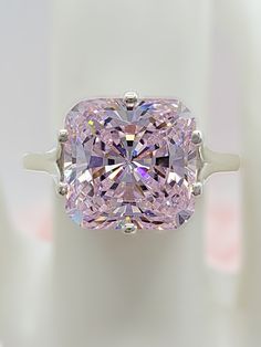 Pink Diamond Cut Diamond Ring, Pink Moissanite Diamond Ring As Gift, Pink Diamond Ring With Diamond Accents For Wedding, Pink Diamond Rings With Diamond Cut, Pink Diamond Ring With Accents For Wedding, Classic Pink Diamond Ring With Accents, Luxury Pink Cubic Zirconia Wedding Jewelry, Pink Cushion Cut Diamond Ring For Formal Occasions, Pink Moissanite Diamond Ring With Brilliant Cut