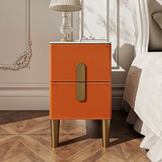 an orange and gold nightstand in a bedroom