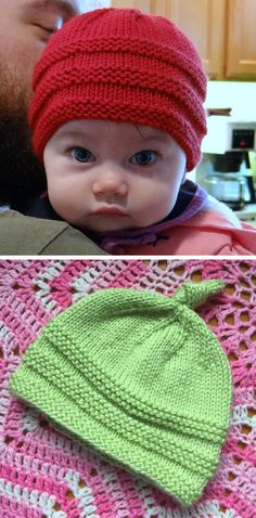 a man holding a baby wearing a knitted hat