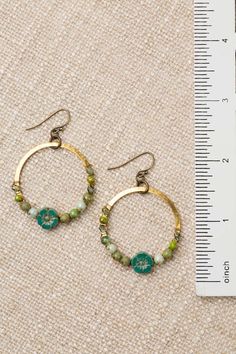 From the Czech Glass collection these charming hoop earrings are handcrafted with intricate designs and delicate colors and are sure to add a touch of whimsy and elegance to any outfit Antique Brass (lead and nickel free) Czech Glass 2", with antique plated brass ear wires We hand select our natural materials, thus there may be slight variations in color and/or size that will not detract from the overall aesthetic Our unique handcrafted designer jewelry for women is made in America, each design