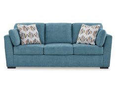 a blue couch with two pillows on it