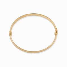 Inspired by the Grand Prix of Monaco, our Moto Bangle exudes style. Featuring a wide, flattened solid gold tube, it is hand etched with a vintage design that offers a classic yet modern look. The Finer Points: Metal: 14 Karat Yellow Gold Dimensions: 8mm Wide Tube, 60mm Diameter Weight: 7.4 Grams Construction: Latch with Figure Eight Closure Origin: Crafted in Arezzo, Italy Gold Hoop Bracelet With Polished Finish, Classic Gold-tone Bangle Bracelet, Classic Gold-tone Bangle For Everyday, Timeless Gold Engraved Bracelets, Timeless Gold Engraved Bangle, Timeless Gold Engraved Bracelet, Timeless Gold Bracelet With Engraving, Classic Jubilee Bracelet Jewelry, Classic Gold Band Bracelet