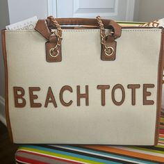 This Tote Bag Is Perfect For Your Summer Wardrobe. The Two Tone Colors Make The Bag Look Super Classy And Stylish. Top Handle Travel Bag For Beach Season, Top Handle Beach Vacation Bags, Top Handle Bags For Beach Season Vacation, Top Handle Bags For Beach Vacation, Sand-colored Tote Shoulder Bag For Beach Season, Sand Tote Shoulder Bag For Beach Season, Beach Season Sand Tote Shoulder Bag, Beach Season Sand-colored Tote Shoulder Bag, Vacation Shoulder Bag With Double Handle And Gold-tone Hardware