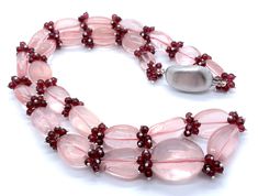 100 % Natural ROSE QUARTZ smooth tumble & Natural RED GARNET smooth round ball shape beaded necklace with 925 Sterling Silver clasp and wires. Details: - Gemstone - Rose Quartz & Red Garnet Shape - Tumble & Round Strand - 1 Calibration - Rose Quartz From 12x15x4MM till 20x26x16MM & Red Garnet 4MM Weight of necklace - 682.00 Carats ( 136.40 Grams ) Length of necklace - 24.50 Inches Each bead is drilled with 1MM diameter hole SKU - HJHOOK0090 100 % NATURAL ROSE QUARTZ SMOOTH TUMBLE BEADS USED  100% NATURAL RED GARNET SMOOTH ROUND BEADS USED 925 STERLING SILVER ITALIAN TUMBLE SHAPE CLASP USED 925 STERLING SILVER WIRES USED UNBREAKABLE THREAD USED READY TO WEAR NECKLACE VERY RARE NECKLACE OF ROSE QUARTZ & RED GARNET PARTY WEAR NECKLACE AMAZING NECKLACE VERY NICE-LOOKING NECKLACE Thank you for Pink Gemstone Accents Necklaces For Formal Occasions, Formal Pink Necklaces With Gemstone Accents, Formal Pink Gemstone Accented Necklaces, Luxury Gemstone Beaded Necklaces For Jewelry Making, Elegant Rondelle Beaded Necklaces With Stones, Elegant Beaded Rondelle Necklaces With Stones, Elegant Single Strand Round Beads, Gemstone Accents Rondelle Necklace Gift, Pink Gemstone Accents Round Necklace