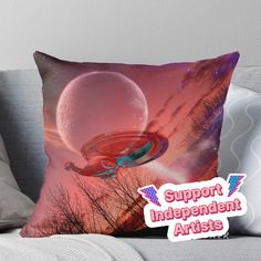 a cushion with the words support independent artists on it and an image of a space ship in